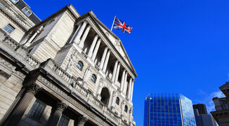 Bank of England with UK flag and cityscape