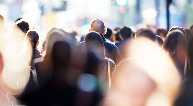 Working people walking outdoors in a city illustrates an article about UK Brexit job jitters