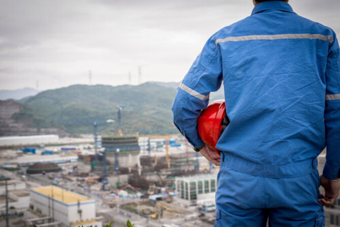 Image of construction worker surveying the scene