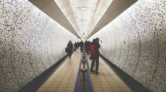 Woman walking in a tunnel