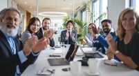 Diverse group of business people applauding viewer