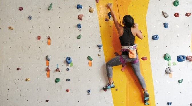 woman-climbing-wall-image