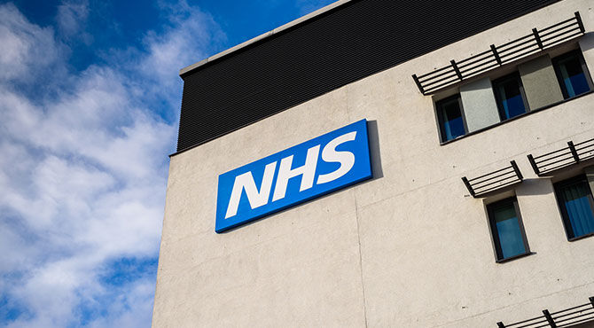 NHS sign on the side of a hospital