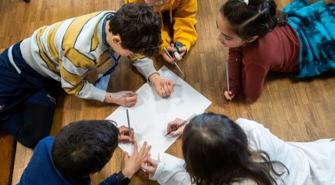 CIS-children-writing-on-shared-paper