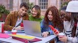 image-of-happy-students-at-laptop-phone