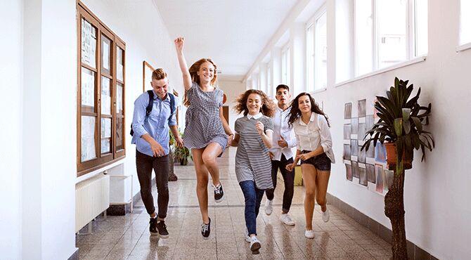 School children run down a corridor