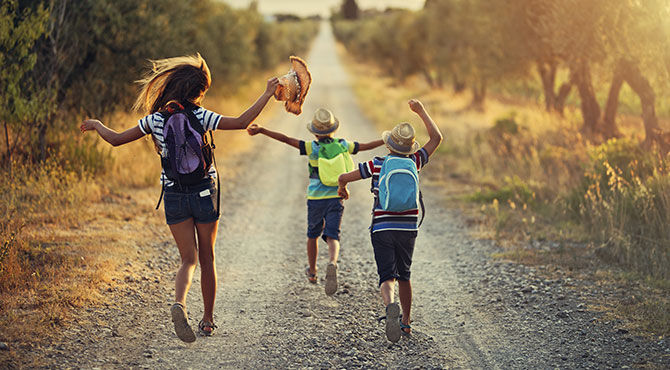 Children jumping on a path